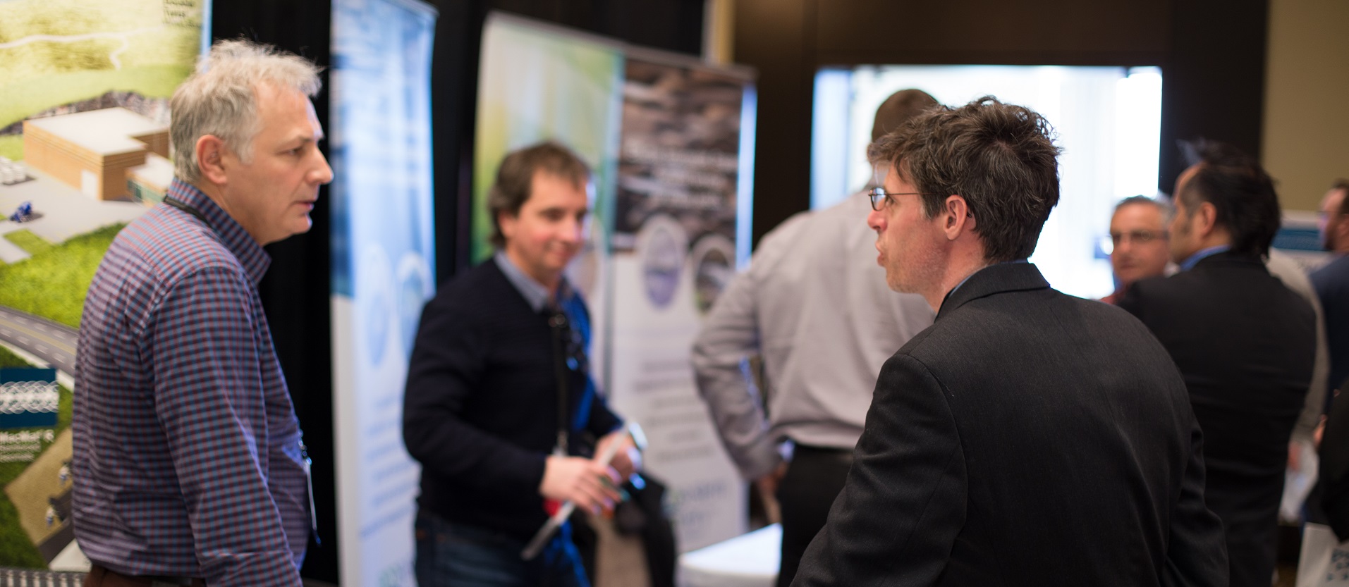 exhibitor chats with attendee at TRIECA conference