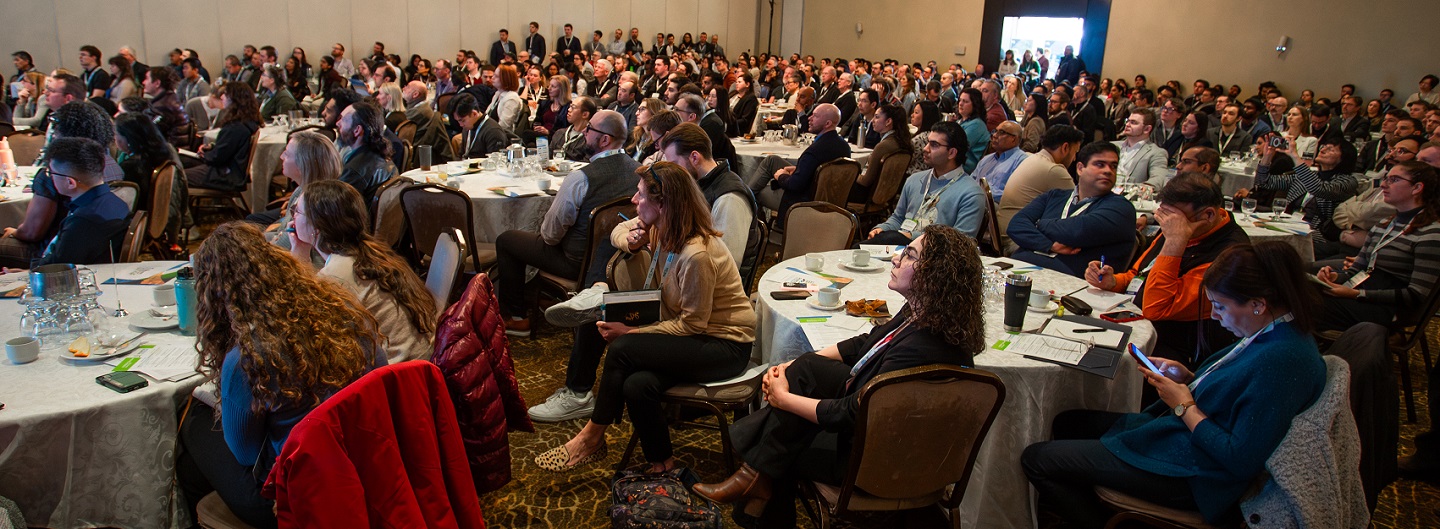 delegates listen intently to a presentation at the Source to Stream conference